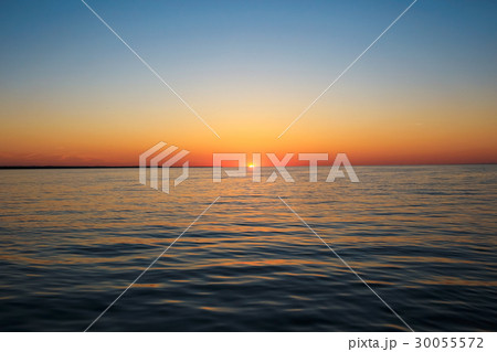 Beautiful sunset on the lake shore 30055572