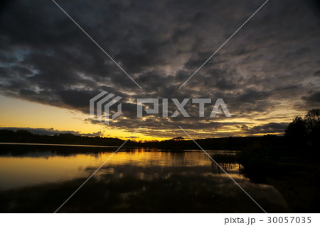 Beautiful sunset on the lake shore 30057035