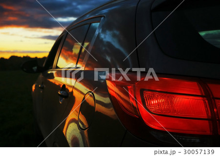 Car in the field at sunset 30057139