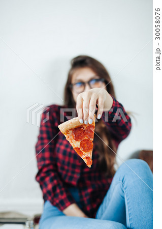 closeup of young girl eating pizza closeup of young girl eating pizza 30058076