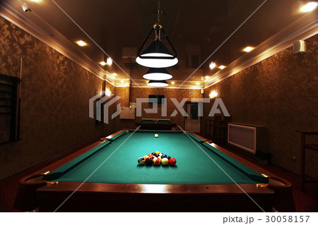 Large room with pool tables 30058157