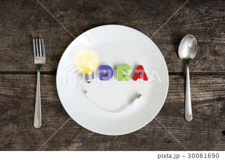 Big light bulb idea glowing with smile 30061690