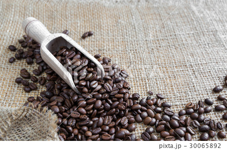 Coffee beans on the rough burlap Coffee beans on the rough burlap 30065892