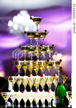 Pyramid of cocktails decorated with cherries  Pyramid of cocktails decorated with cherries  30068516