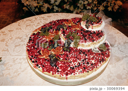 Delicious wedding cake made with white cream Delicious wedding cake made with white cream 30069394