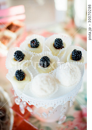 Little tasty white cakes decorated Little tasty white cakes decorated 30070286