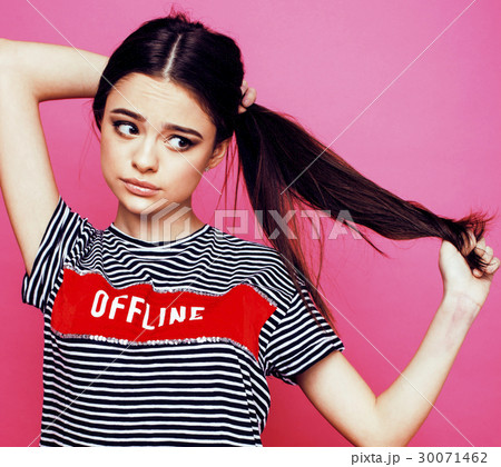 young pretty teenage woman emotional posing on 30071462