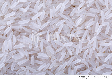 Dry uncooked rice background 30077342