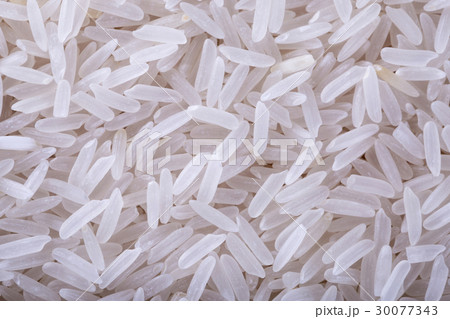 Dry uncooked rice background 30077343