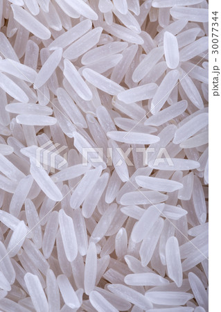 Dry uncooked rice background 30077344