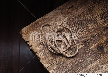 Rope on a wooden table Rope on a wooden table 30077860