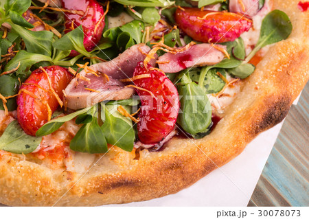 A pizza piece with a duck breast, tangerines, sala A pizza piece with a duck breast, tangerines, sala 30078073