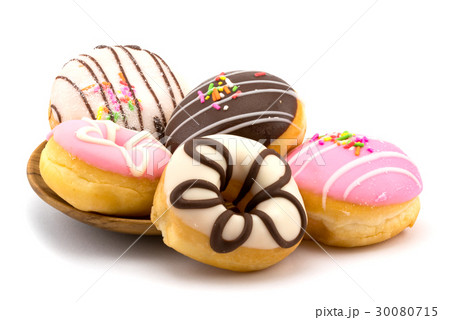 Tasty homemade doughnuts in a wooden plate Tasty homemade doughnuts in a wooden plate 30080715
