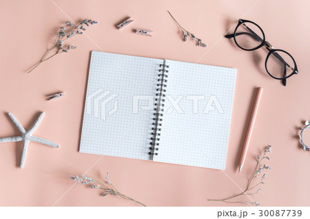 Blank notebook with flower on color background 30087739
