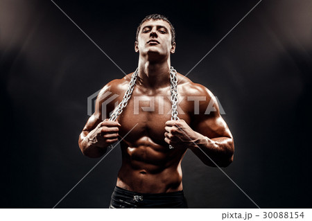 Muscular topless fighter in boxing gloves Muscular topless fighter in boxing gloves 30088154