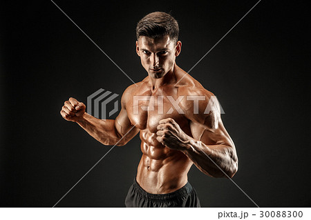 bodybuilder posing. Beautiful sporty guy male bodybuilder posing. Beautiful sporty guy male 30088300