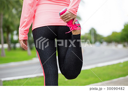 Fitness woman runner stretching before jogging Fitness woman runner stretching before jogging 30090482