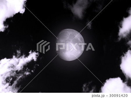 The moon in the night sky in clouds 30091420