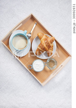 breakfast in bed with coffee and croissants 30092651