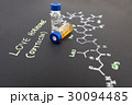 Close-up blue cap sample vial on paper  30094485