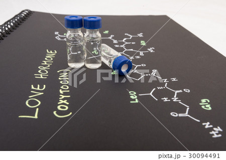 Close-up blue cap sample vial on paper Close-up blue cap sample vial on paper 30094491