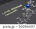 Close-up blue cap sample vial on paper  30094497