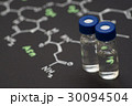 Close-up blue cap sample vial on paper  30094504