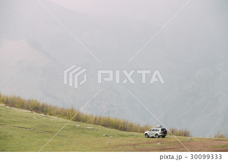 SUV Car On Off Road In Spring Mountains Landscape 30099333