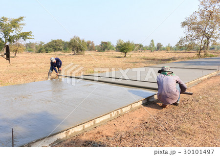 workers were building a concrete road workers were building a concrete road 30101497