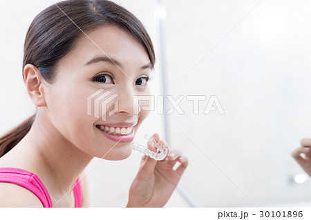 woman with invisible braces woman with invisible braces 30101896