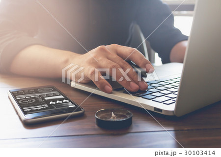 businessman hand working laptop on wooden desk. businessman hand working laptop on wooden desk. 30103414