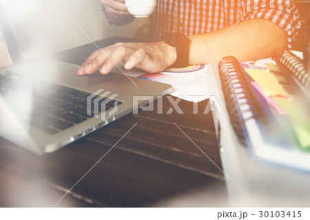 businessman hand working laptop on wooden desk. businessman hand working laptop on wooden desk. 30103415