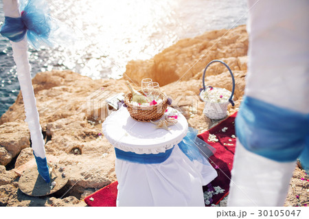 wedding in cyprus, bride and groom on a stone 30105047