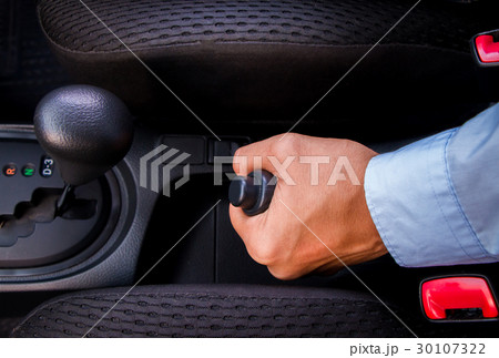 A business man holding gear  30107322