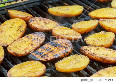 Potatoes, and meat roasted on skewers BBQ grill Potatoes, and meat roasted on skewers BBQ grill 30114394