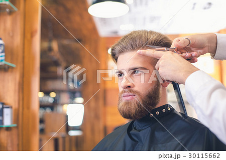 Young Man in Barber Shop Hair Care Service Concept Young Man in Barber Shop Hair Care Service Concept 30115662