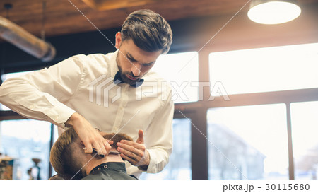 Young Man in Barbershop Hair Care Service Concept Young Man in Barbershop Hair Care Service Concept 30115680