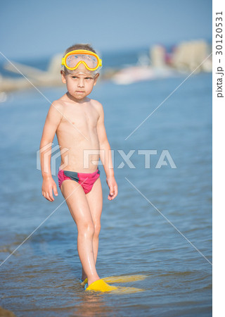 Cute little kid wearing mask and flippers for 30120531