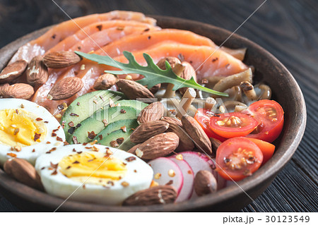 Healthy bowl with salmon, avocado, egg and vegs 30123549