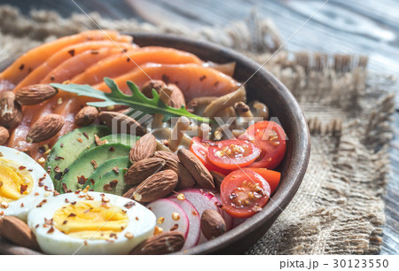 Healthy bowl with salmon, avocado, egg and vegs 30123550