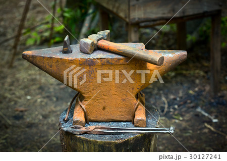 The blacksmithl on the anvil 30127241