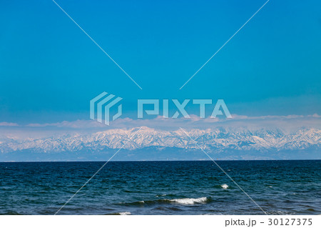 富山湾から見た立山連峰の写真素材