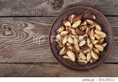 Brazil nuts in a plate 30129311