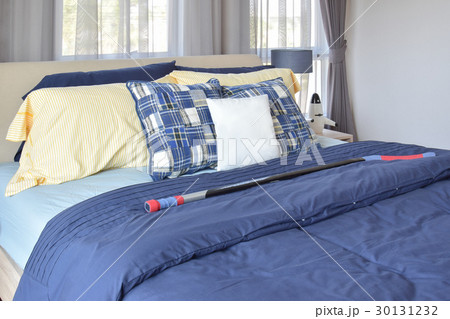 stylish bedroom with blue patterned pillows on bed 30131232