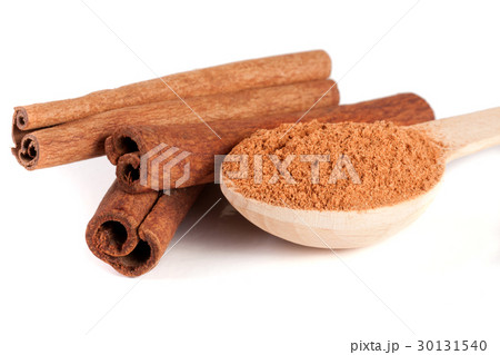 three cinnamon sticks and powder with spoon three cinnamon sticks and powder with spoon 30131540