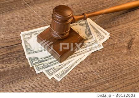 Photo of hammer on banknotes 30132003