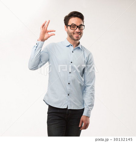 Young happy man showing presentation, pointing on Young happy man showing presentation, pointing on 30132145