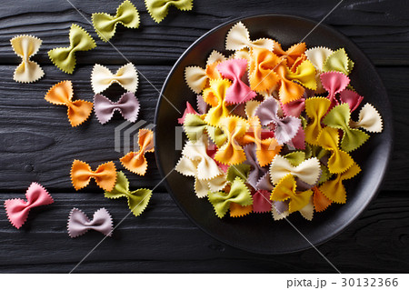 Beautiful Italian uncooked colored farfalle pasta 30132366