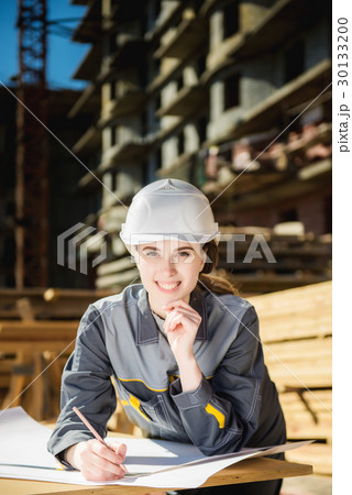Female worker at a construction 30133200