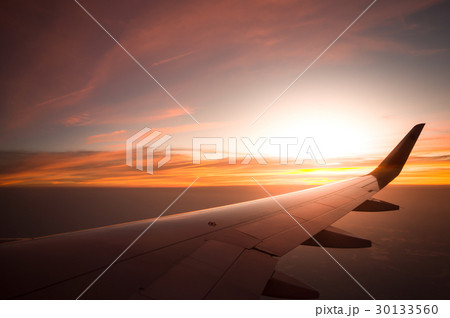 Sunset time with airplane wing from the inside, Sunset time with airplane wing from the inside, 30133560